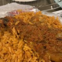 Jollof Rice · Delicious West African rice cooked in stewed tomato sauce, with sliced fried plantain, moin-...