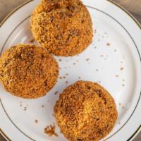 Scotch Egg · Hard-boiled egg enclosed in a layer of sausage meat, crusted with egg and bread-crumbs. (Ima...