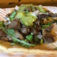 Steak Taco · Cilantro, onion and salsa.
