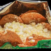 Tostiesquites / Tostitos & Elote Corn · bag of Tostitos and mixed with corn grains, mayonnaise, cotija cheese, and chili powder
