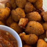 Spicy Cheese Curds · served with a side of house made ranch and marinara