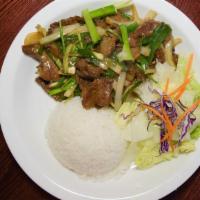 Mongolian Beef · Served with salad and rice.