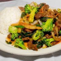 Broccoli Beef · Served with salad and rice.