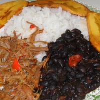 Pabellon Criollo Dish · Shredded Beef, black beans, sweet plantain. white cheese and white rice