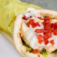 Chicken Gyro · Charbroiled chicken slices wrapped in pita bread with diced tomatoes, onions, and our house ...