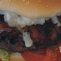 Blue Bacon Burger Combo · A 1/4 lb patty with bacon, blue cheese dressing, tomato, lettuce, and grilled onions (Includ...