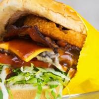 Double Western Bacon Cheeseburger · Two 1/4 lb patties with bacon, bbq sauce, an onion ring, American cheese, lettuce, tomato, a...