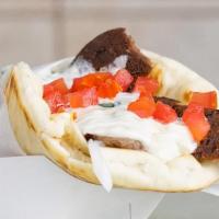 Gyro Sandwich · Sliced lamb/beef wrapped in pita bread with diced tomatoes, onions, and our house made tzatz...