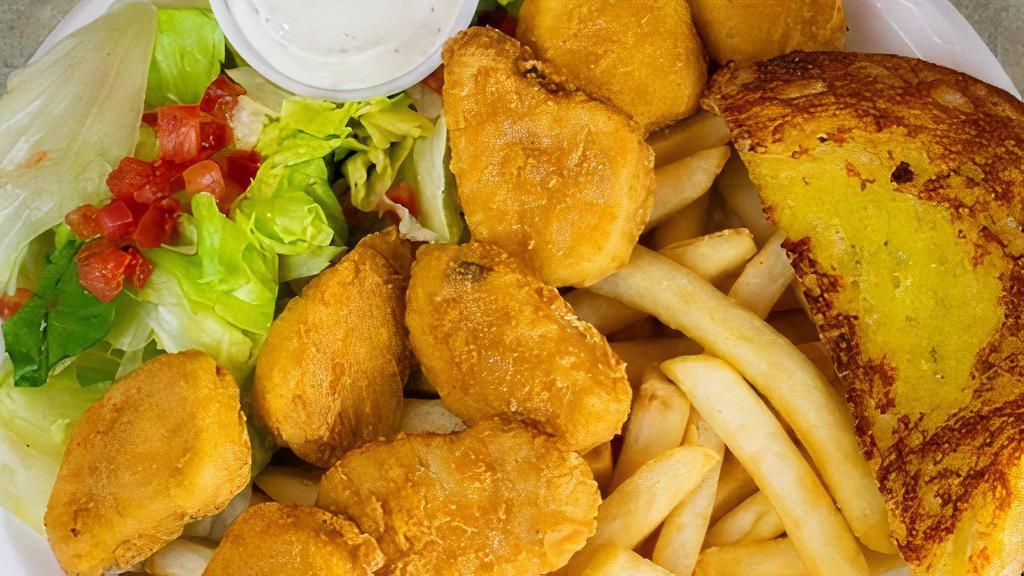 9 Piece Chicken Nuggets Dinner · 9 chicken nuggets served with your choice of french fries or rice (Side salad and two pieces of Texas Toast included)