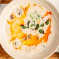 Tom Kha Gai / ต้มข่าไก่ · Gluten free. Mild. A coconut milk soup with chicken, button mushrooms,lemon grass, lime leav...