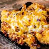 Loaded Fried Cauliflower · Loaded with jack-cheddar cheese, bacon, and sautéed onion.