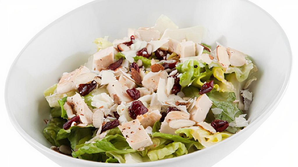 Aloha Chicken · chopped romaine lettuce / grilled chicken / toasted almonds / diced pineapples / dried cranberries / parmesan-romano-asiago cheese blend / apple cider vinaigrette