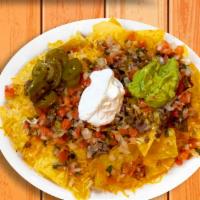 Nachos Supreme · Warm corn tortilla chips, with your choice of meat, beans, melted cheese, pico de gallo, sou...