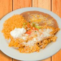 Chilaquiles · Lightly fried corn tortillas simmered in our red sauce, scrambled eggs, sour cream, pico de ...