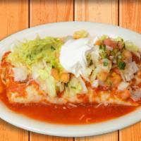 Deluxe Burrito · Flour tortilla filled with your choice of meat, rice, beans, topped with our special sauce, ...