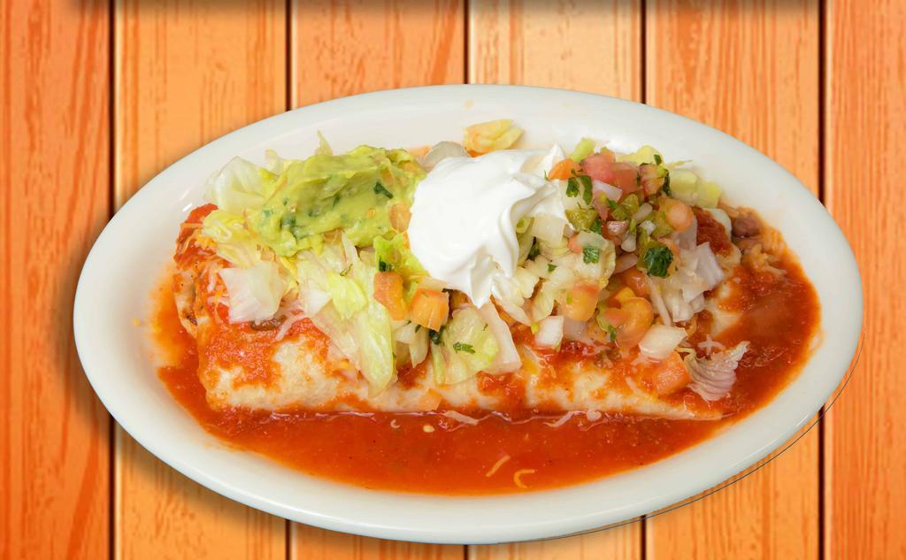 Deluxe Burrito · Flour tortilla filled with your choice of meat, rice, beans, topped with our special sauce, melted cheese, guacamole, pico de gallo, and sour cream.
