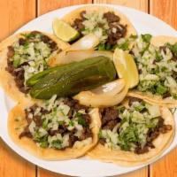 5 Tacos · Corn tortillas topped with your choice of meat, onions, and cilantro.