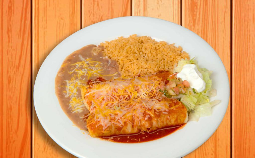 Enchiladas Rancheras · Two corn tortillas filled with your choice of meat and topped with our salsa ranchera, melted cheese, and sour cream. Served with rice & beans.