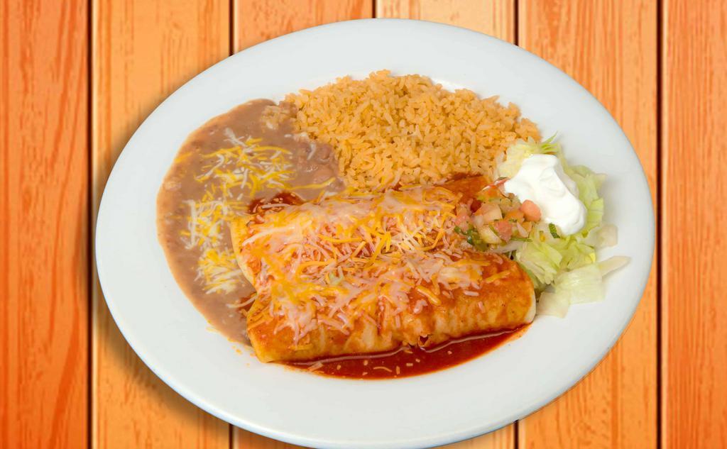 Enchiladas Rancheras · Two corn tortillas filled with your choice of meat and topped with our salsa ranchera, melted cheese, and sour cream. Served with rice & beans.
