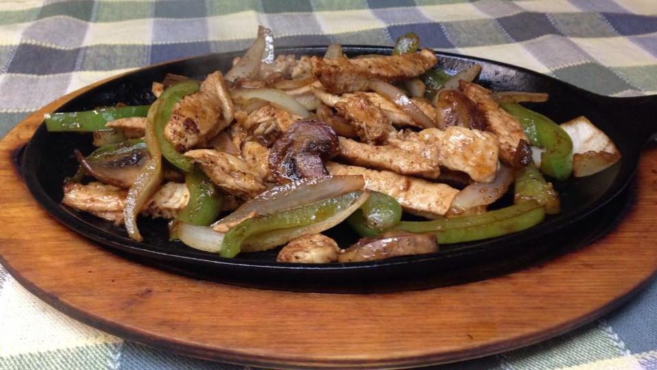 Chicken Fajitas · Tender strips of boneless chicken in a special fajita sauce with mushrooms, onions, and bell peppers served with rice beans.