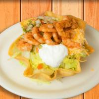 Shrimp Taco Salad · Flour tortilla shell with rice and beans, lettuce, cheese, pico de gallo, sour cream, topped...