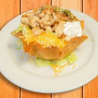 Fish Taco Salad · Flour tortilla shell with rice and beans, lettuce, cheese, pico de gallo, sour cream, topped...
