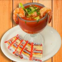Cocktail De Camaron · Cooked prawns served in homemade cocktail sauce with fresh tomatoes, onions, cilantro, and a...
