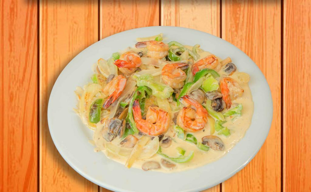 Camarones À La Crema · Shrimp sautéed with onion, green pepper, mushrooms in a delicious creamy sauce. Served on a bed of rice.