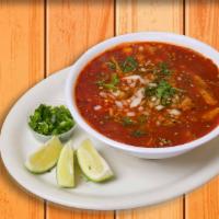Menudo · Delicious tripe soup in broth with red chili pepper base, with chopped onions, diced jalapeñ...