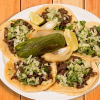 5 Tacos · Corn tortillas topped with your choice of meat, onions, and cilantro.