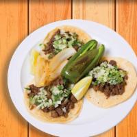 3 Tacos · Corn tortillas topped with your choice of meat, onions, and cilantro.