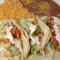 3 Tacos Plate · Soft corn tortillas topped with your choice of meat, onions, and cilantro. Served with rice ...