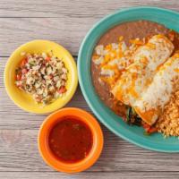 Enchiladas Espinaca · A corn tortilla stuffed with spinach, bell peppers, onions, tomatoes, and mushrooms. Topped ...