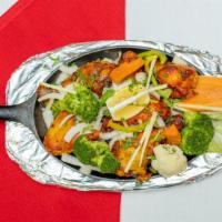 Chicken Tandoori · Gluten-free. Chicken on the bone marinated in yogurt and traditional spices, and roasted in ...