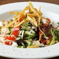 Tamarindo Salad · Cabbage, spring mix, diced onions, roasted red peppers, roasted corn, honey lime dressing, T...