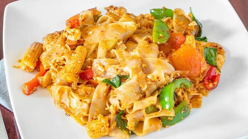 Drunken Noodles · Stir-fried rice noodle with eggs, tomatoes, bell peppers, bamboo shoot, baby corn and fresh basil in our spicy basil sauce