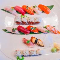 Super Deluxe Sushi Plate · Chef selection of 12 omakase nigiri  and spicy tuna roll. (Picture does not necessarily refl...