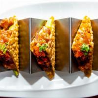 Spicy Tuna Tacos · Tuna, masago, avocado, jalepeno, cilantro, green onion, & sweet chili aioli in a crispy shel...