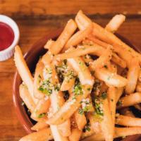 Truffle Fries · Crispy golden potatoes with truffle, parmesan and parsley.