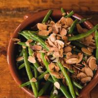 Haricot Verts  · Green beans sautéed with shallots, butter, almonds and fresh herbs.