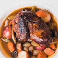 Coq Au Vin · Red wine braised chicken with vegetables, potatoes & jus.
