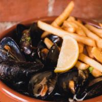 Moules Frites · Mussels with garlic, butter, shallots,  white wine and crispy fries.