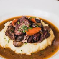 Beef Bourguignon  · Red wine braised beef, pearl onions, bacon & mushrooms with creamy mashed potatoes