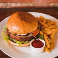 Veggie Burger · House-made yam-quinoa patty on a brioche bun with pickled veg and a side of fries .