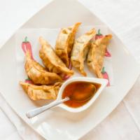 Pot Sticker (6 Pieces) · Mixed veggies and ground pork wrapped with wonton and deep fried until golden brown, served ...