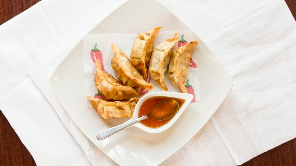 Pot Sticker (6 Pieces) · Mixed veggies and ground pork wrapped with wonton and deep fried until golden brown, served with sweet chili sauce.