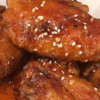 Crazy Wings · Battered & Fried wings lathered with a sweet & mildly spicy sauce...Delicious!