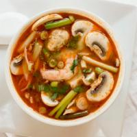Tom Yum · Hot and sour mixed with lemongrass, galangal root, onions, tomatoes, lime leaves, mushrooms,...