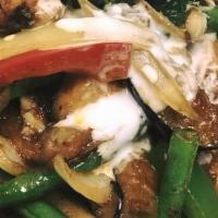 Pad Phet · Bamboo shoots, eggplant, onions, bell peppers, basil leaves, stir fried with Thai chili paste.