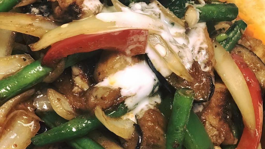 Pad Phet · Bamboo shoots, eggplant, onions, bell peppers, basil leaves, stir fried with Thai chili paste.